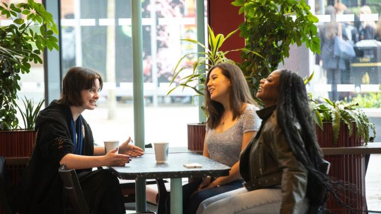 three female students chatting